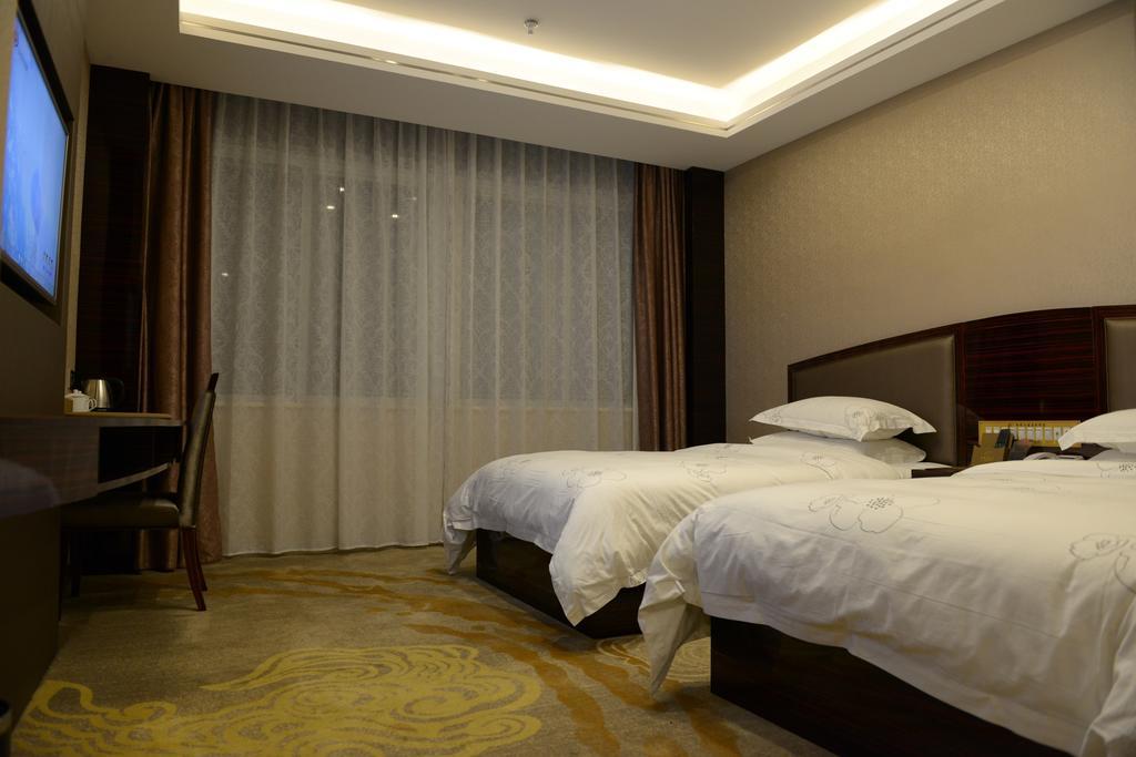 Tie Cheng Hotel Guangzhou Room photo
